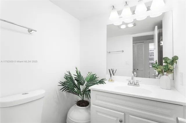 a bathroom with a sink a shower and a mirror