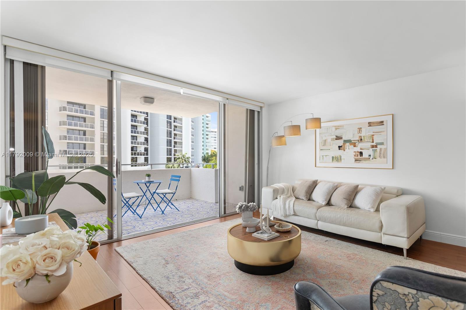 11 Island Avenue, Unit 407 Miami Beach, FL 33139 - Photo 2 of 44 a living room with furniture and a large window