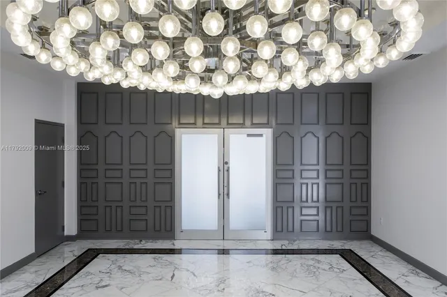 a gaming hall with lots of furniture and a view of living room