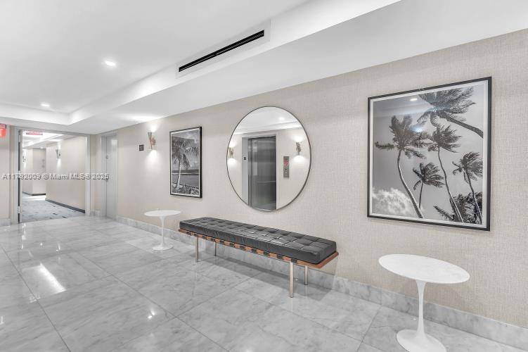 11 Island Avenue, Unit 407 Miami Beach, FL 33139 - Photo 31 of 44 a room with furniture and a mirror