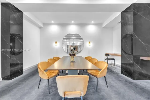 a living room with granite countertop furniture and a chandelier
