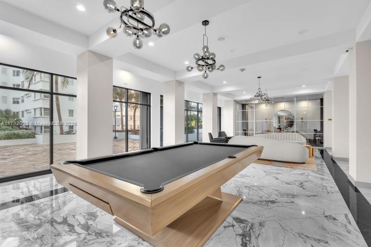 11 Island Avenue, Unit 407 Miami Beach, FL 33139 - Photo 33 of 44 a living room with granite countertop furniture and a chandelier