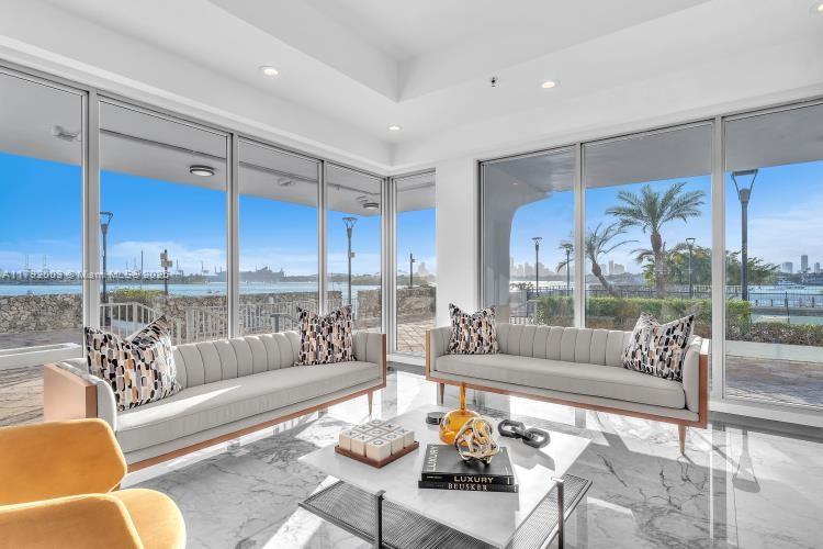 11 Island Avenue, Unit 407 Miami Beach, FL 33139 - Photo 34 of 44 a living room with furniture and a large window