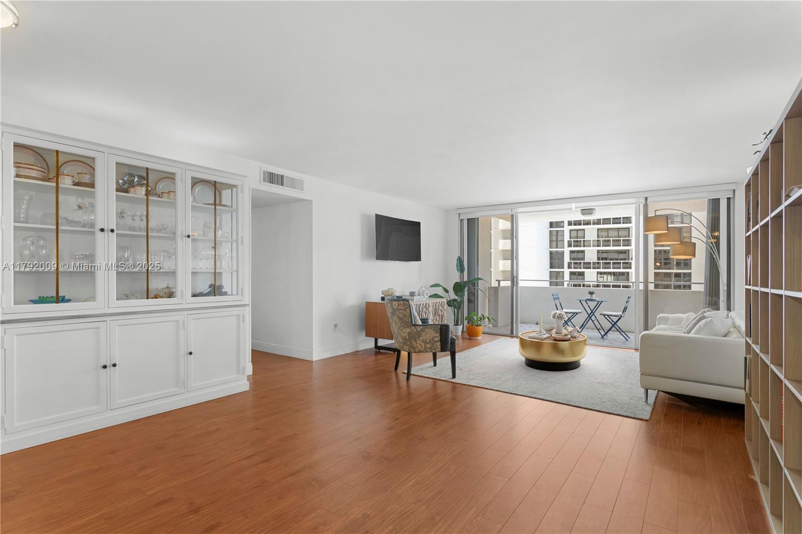 11 Island Avenue, Unit 407 Miami Beach, FL 33139 - Photo 6 of 44 a living room with furniture and a large window