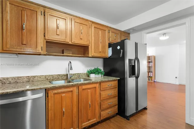 a kitchen with a table and chairs in it