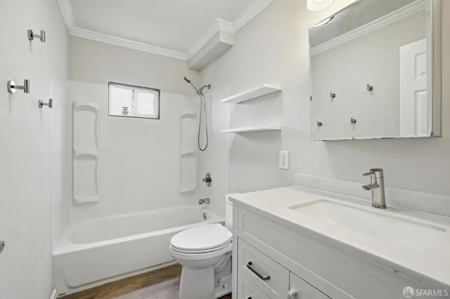 a bathroom with a sink a toilet and bathtub