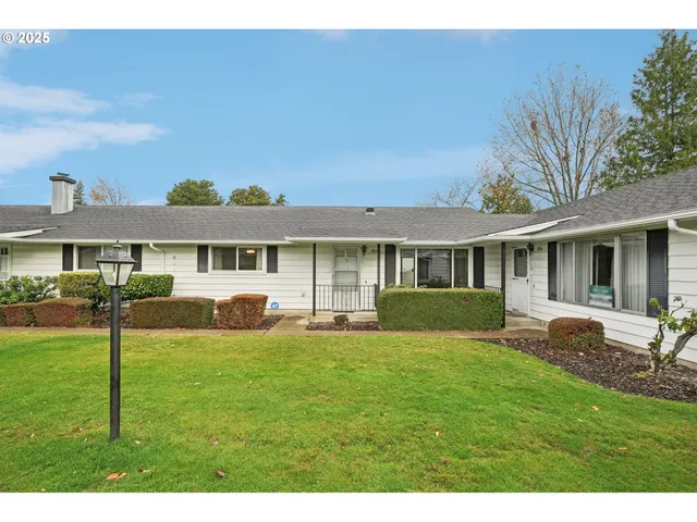 a front view of a house with a yard and porch