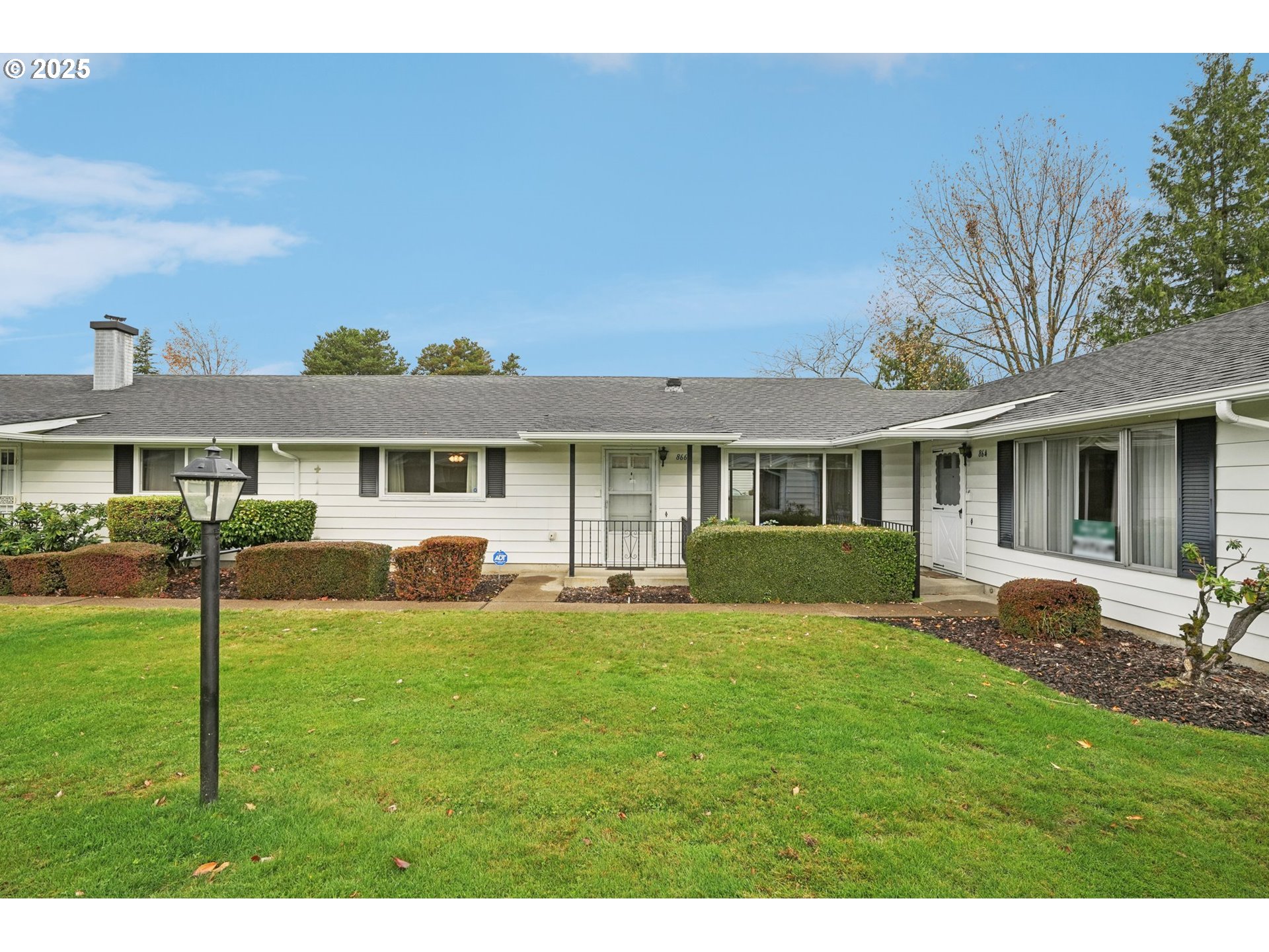 a front view of a house with a yard and porch