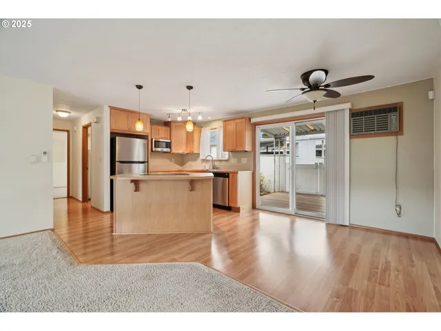 a view of a kitchen with wooden floor