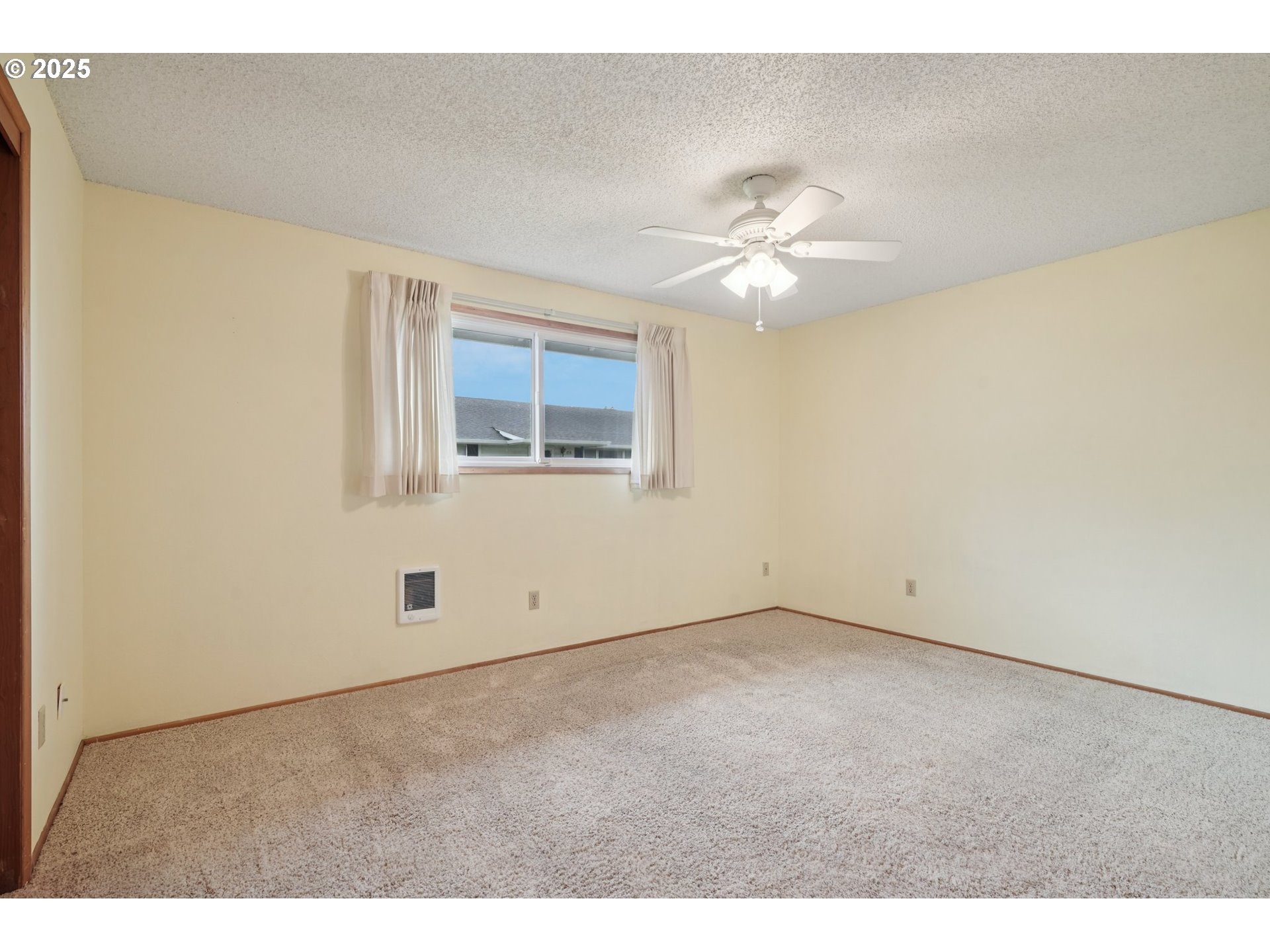 866 Northeast Fleming Avenue, Unit B83 Gresham, OR 97030 - Photo 17 of 27 a view of an empty room with a window