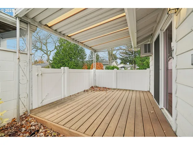 a view of wooden floor with a wooden fence