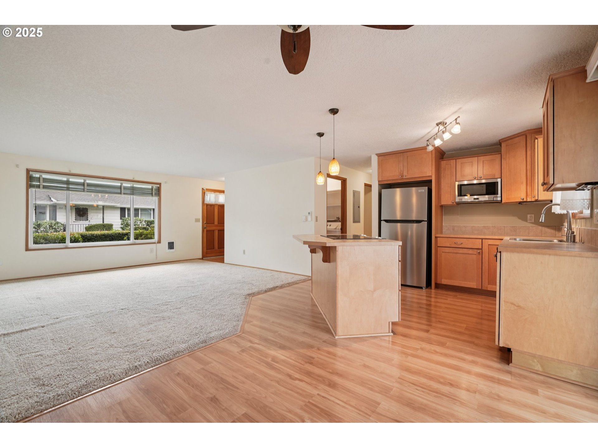 866 Northeast Fleming Avenue, Unit B83 Gresham, OR 97030 - Photo 9 of 27 a view interior of kitchen and hall with wooden floor