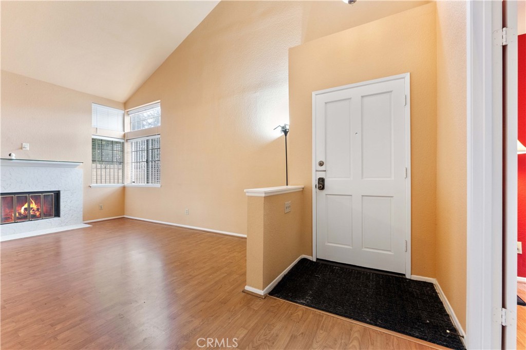 3635 Daybreak Street El Monte, CA 91732 - Photo 3 of 24 an empty room with wooden floor cabinet and fireplace