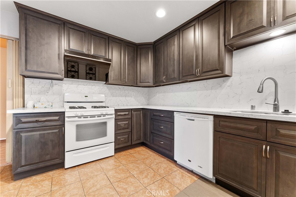3635 Daybreak Street El Monte, CA 91732 - Photo 7 of 24 a kitchen with cabinets stainless steel appliances and sink