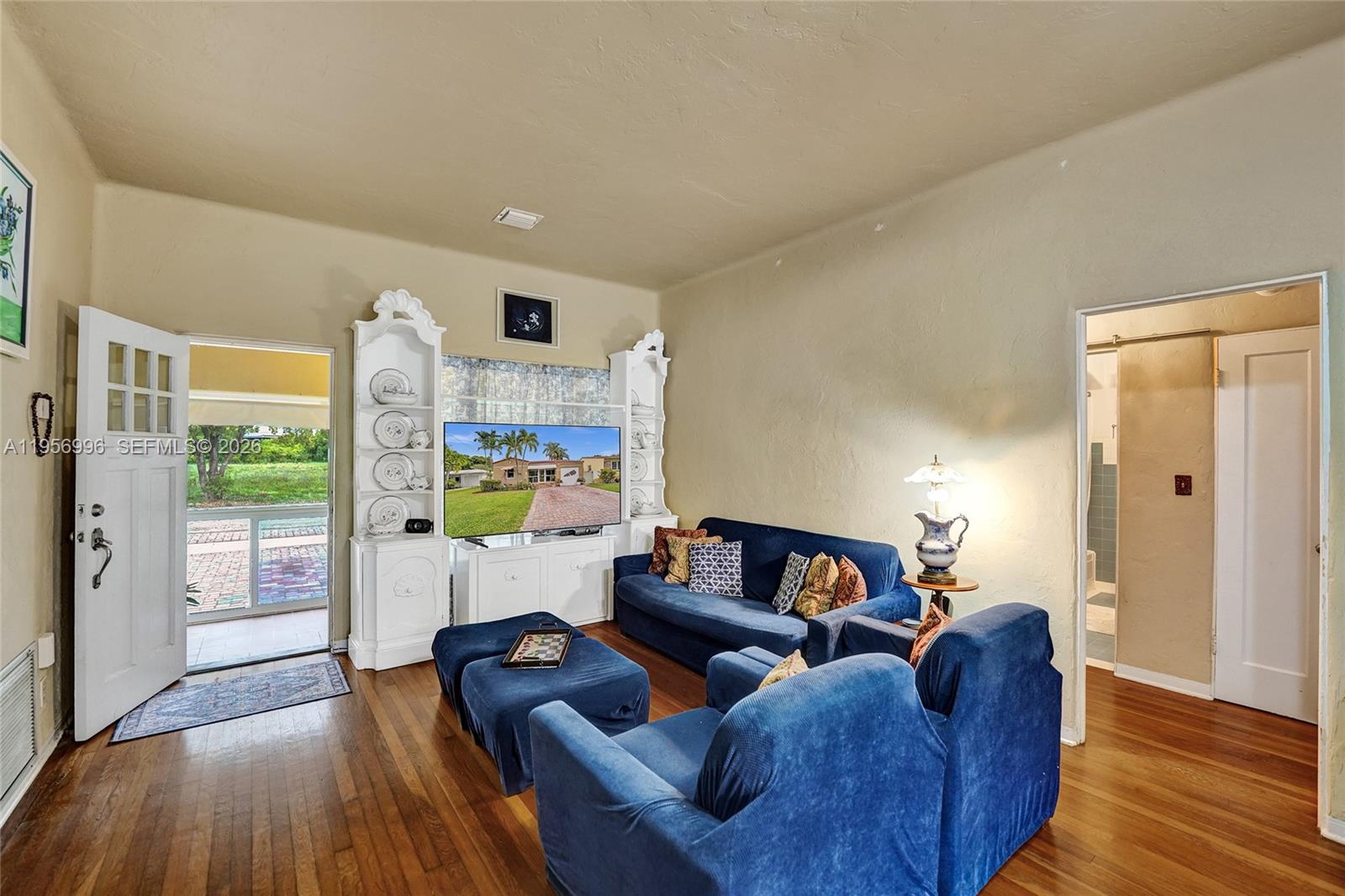 1340 Jackson Street Hollywood, FL 33019 - Photo 11 of 49 a living room with furniture and a wooden floor