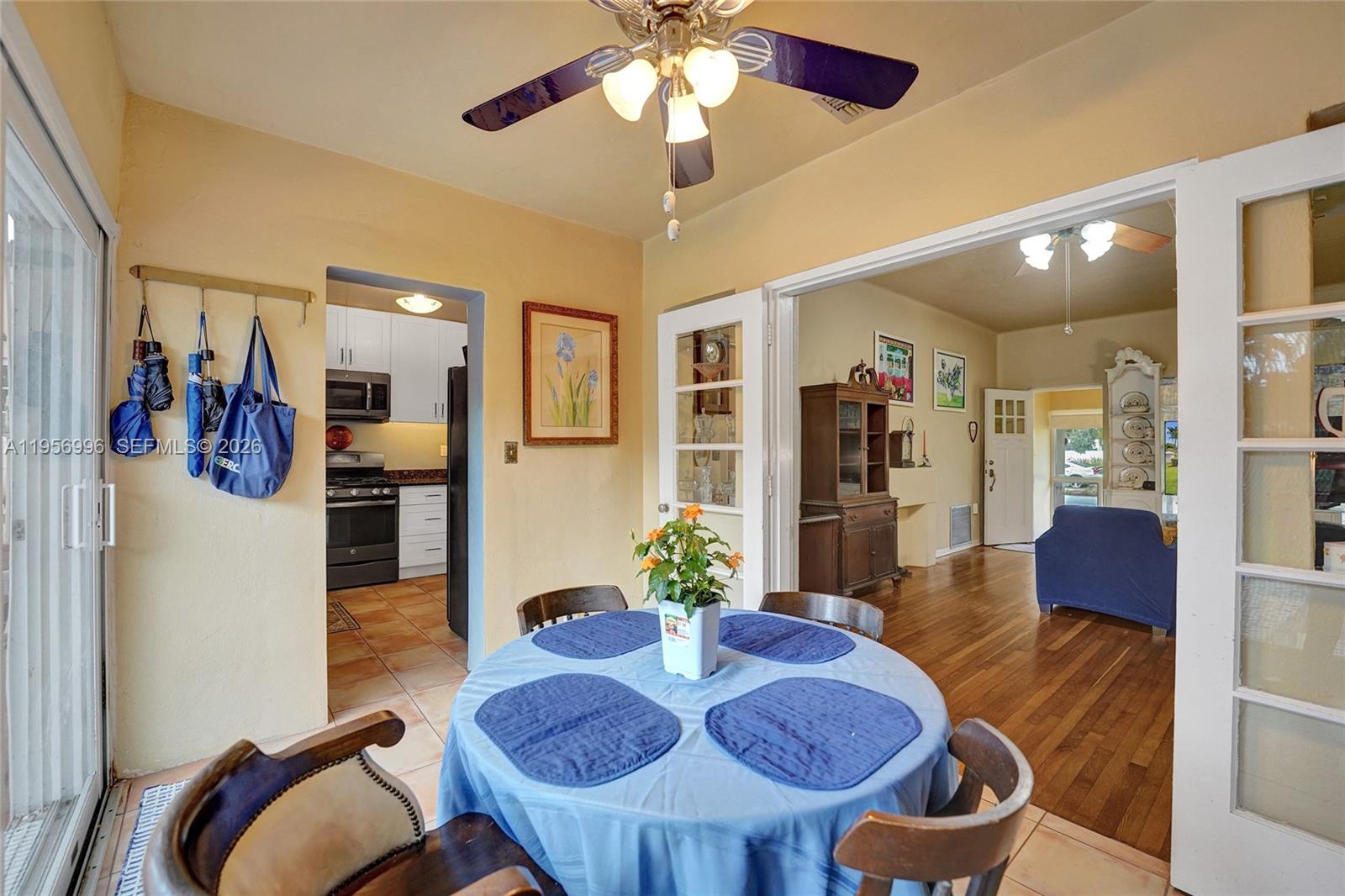 1340 Jackson Street Hollywood, FL 33019 - Photo 20 of 49 a living room with furniture and a chandelier