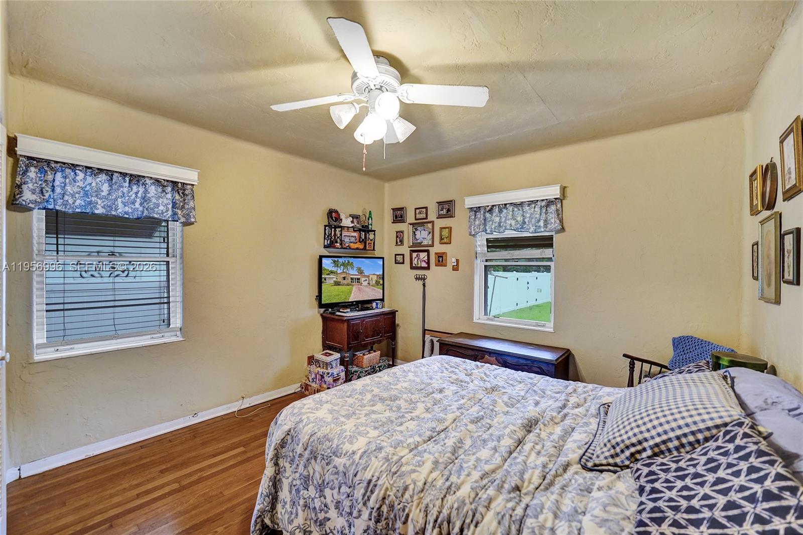 1340 Jackson Street Hollywood, FL 33019 - Photo 28 of 49 a bedroom with a bed and a window