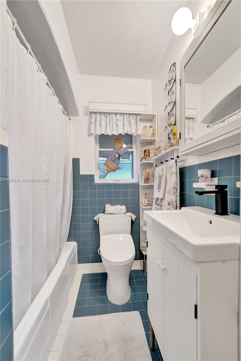 1340 Jackson Street Hollywood, FL 33019 - Photo 31 of 49 a bathroom with a sink toilet and shower