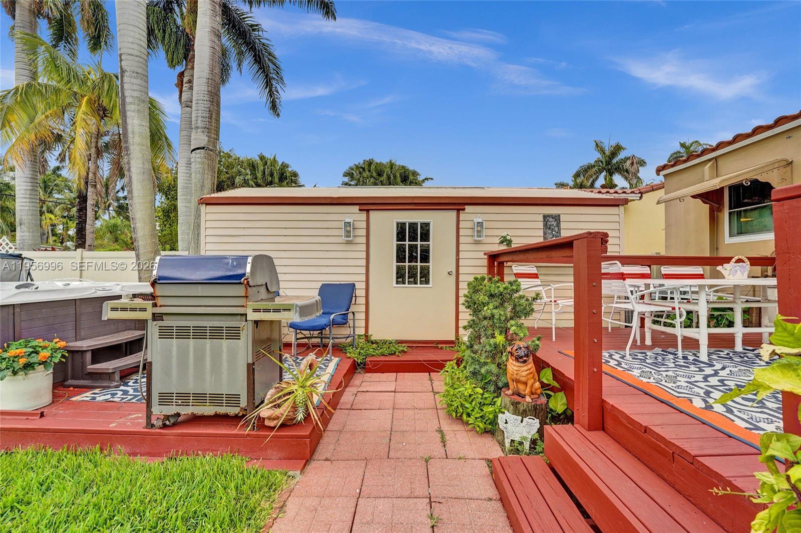 1340 Jackson Street Hollywood, FL 33019 - Photo 35 of 49 a front view of a house with outdoor seating