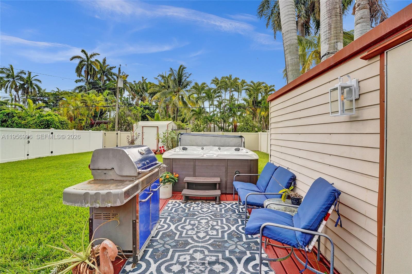 1340 Jackson Street Hollywood, FL 33019 - Photo 36 of 49 a view of a chairs and table in the garden