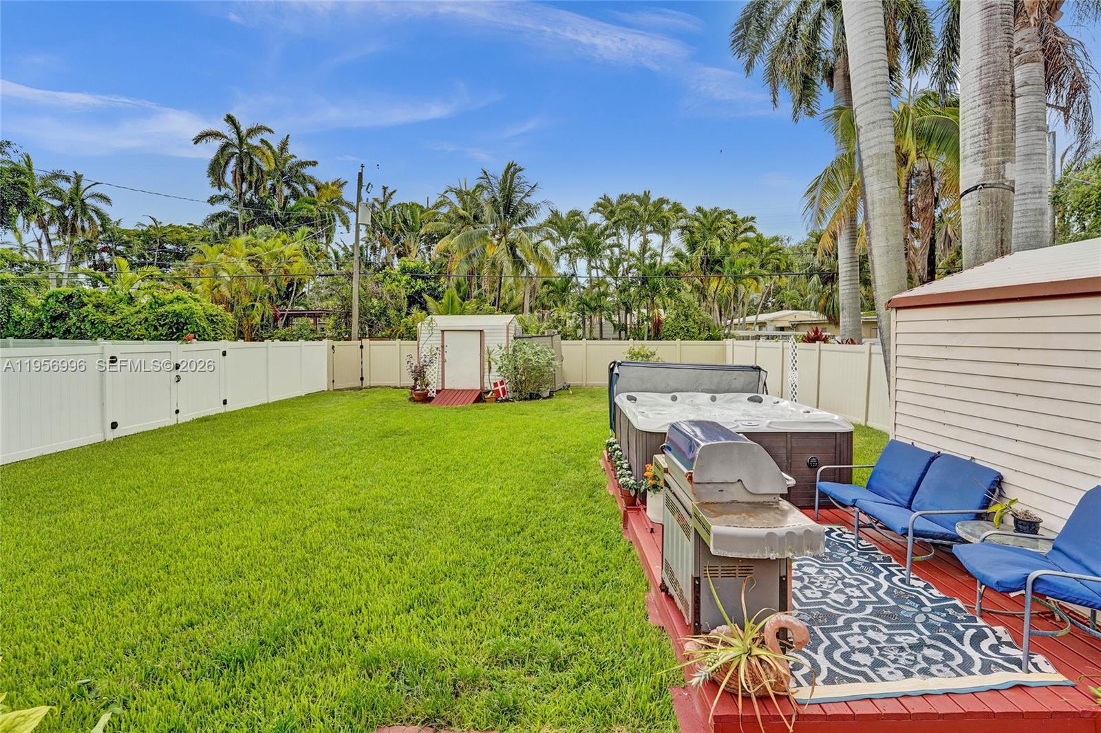 1340 Jackson Street Hollywood, FL 33019 - Photo 37 of 49 a view of backyard with seating area and green space