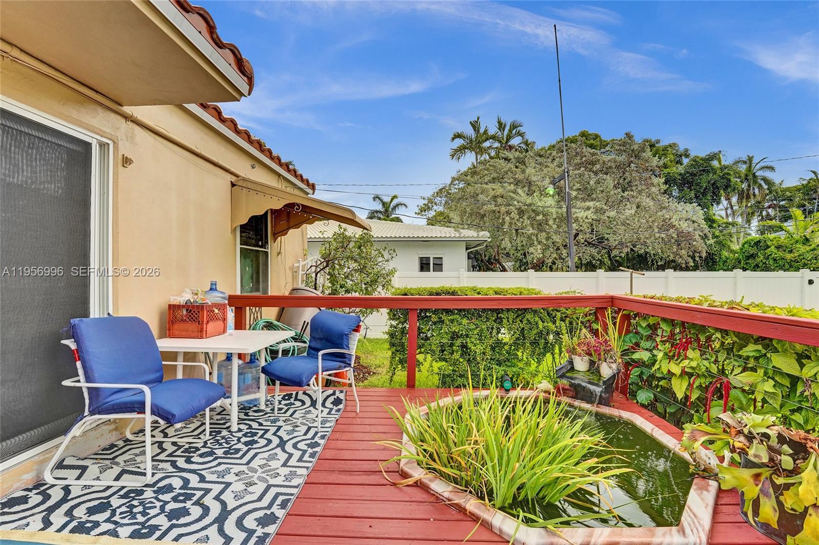 1340 Jackson Street Hollywood, FL 33019 - Photo 38 of 49 a balcony with furniture and a potted plant