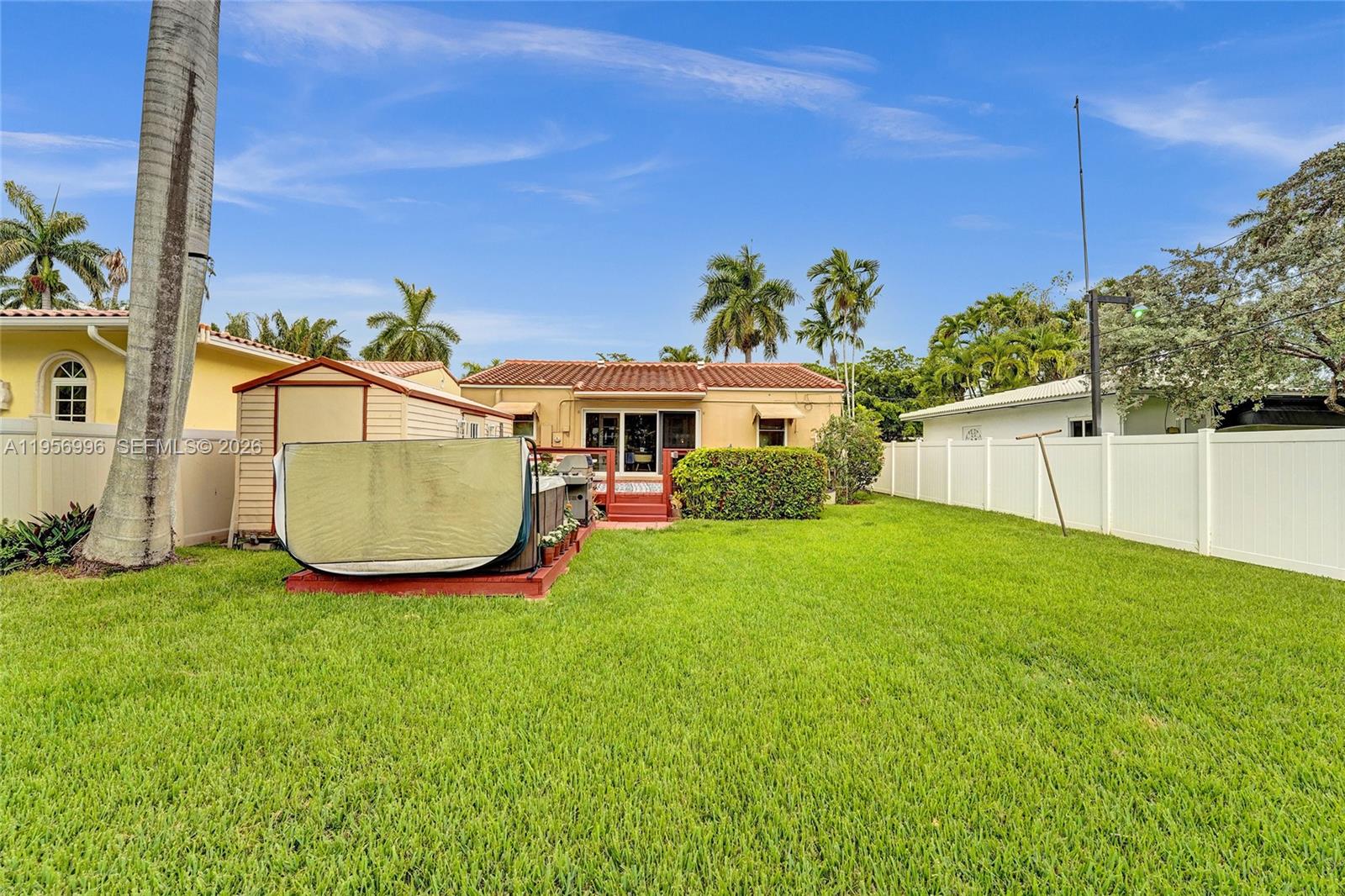 1340 Jackson Street Hollywood, FL 33019 - Photo 43 of 49 a view of a house with a backyard and a swimming pool