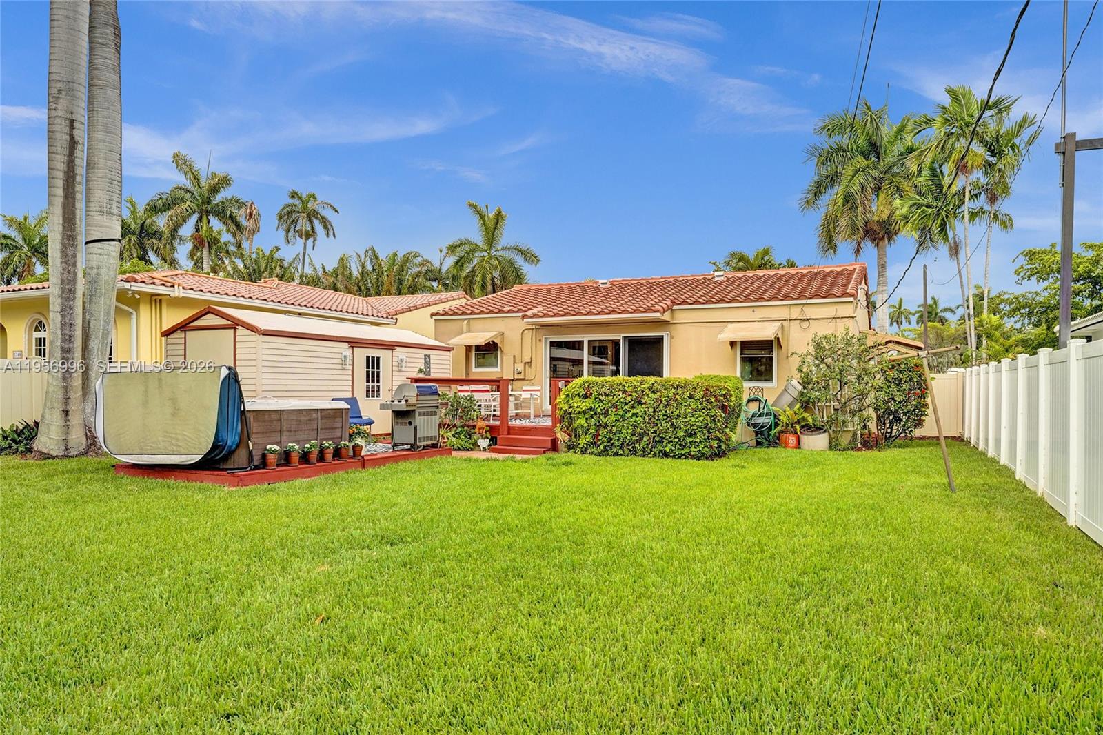 1340 Jackson Street Hollywood, FL 33019 - Photo 44 of 49 a view of a house with a yard and sitting area