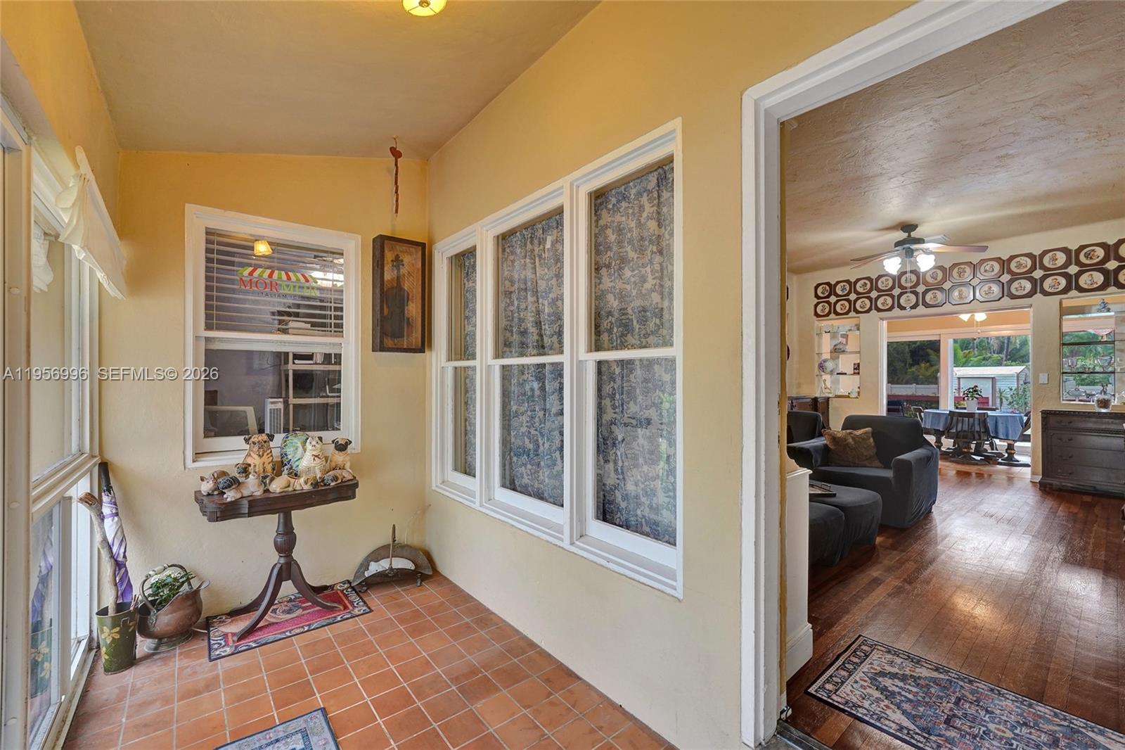 1340 Jackson Street Hollywood, FL 33019 - Photo 6 of 49 a view of a livingroom with workspace and a window