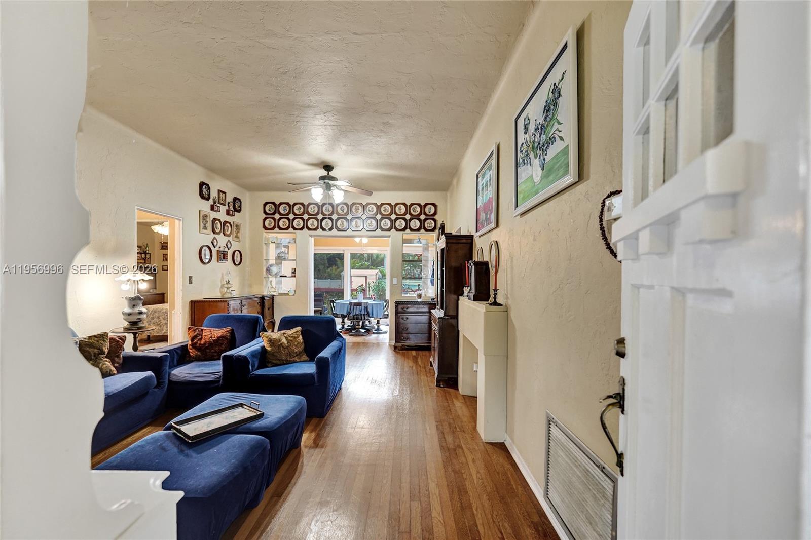 1340 Jackson Street Hollywood, FL 33019 - Photo 7 of 49 a living room with furniture and a fireplace