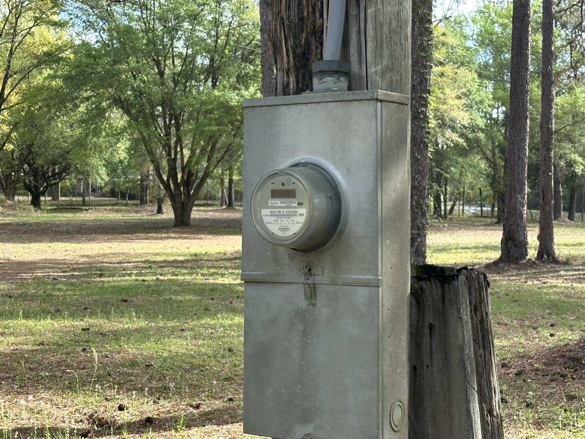3421 Airport Road Crestview, FL 32539 - Photo 15 of 54 a close up of a fountain with a tree in the background