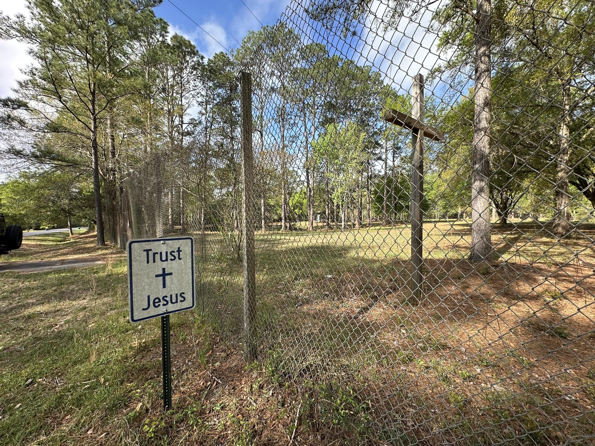 3421 Airport Road Crestview, FL 32539 - Photo 53 of 54 a sign board with yard in the back