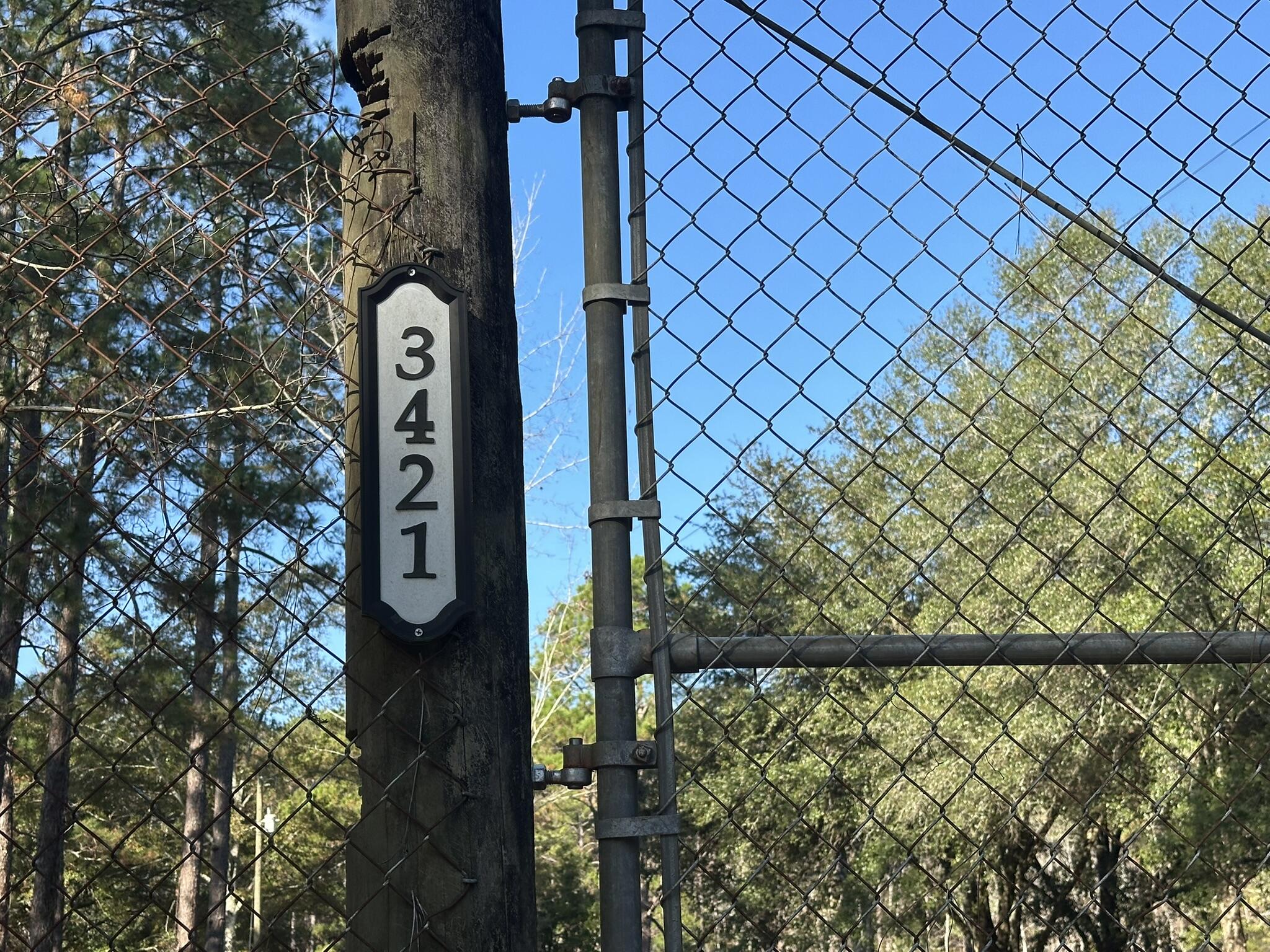 3421 Airport Road Crestview, FL 32539 - Photo 54 of 54 a view of a fence and trees