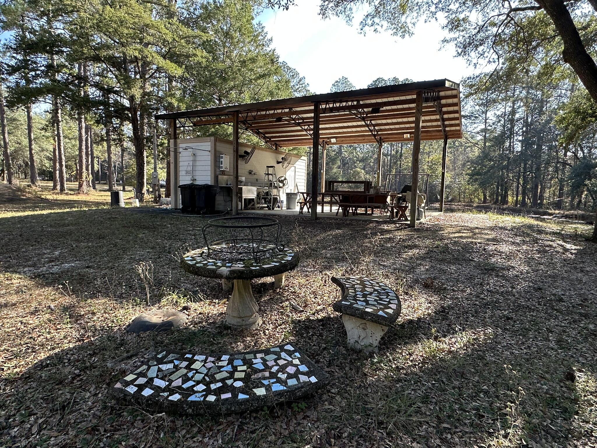 3421 Airport Road Crestview, FL 32539 - Photo 7 of 54 a view of a back yard on the house