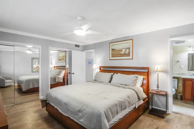 a bedroom with a bed and a view of bathroom