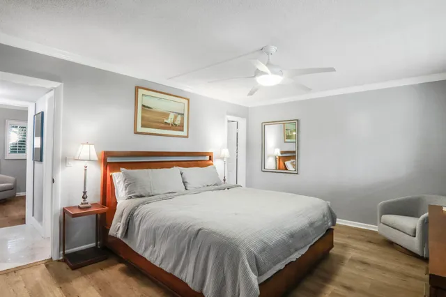 a bedroom with a bed and a couch