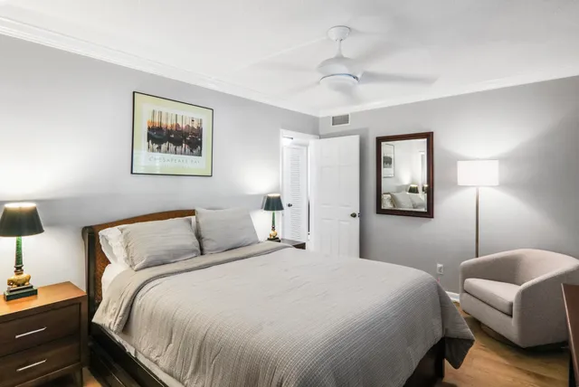 a bedroom with a bed and a lamp