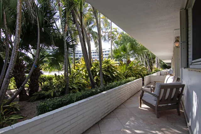 a view of balcony with furniture