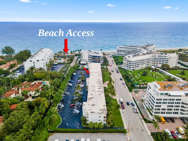 a front view of a building with a garden