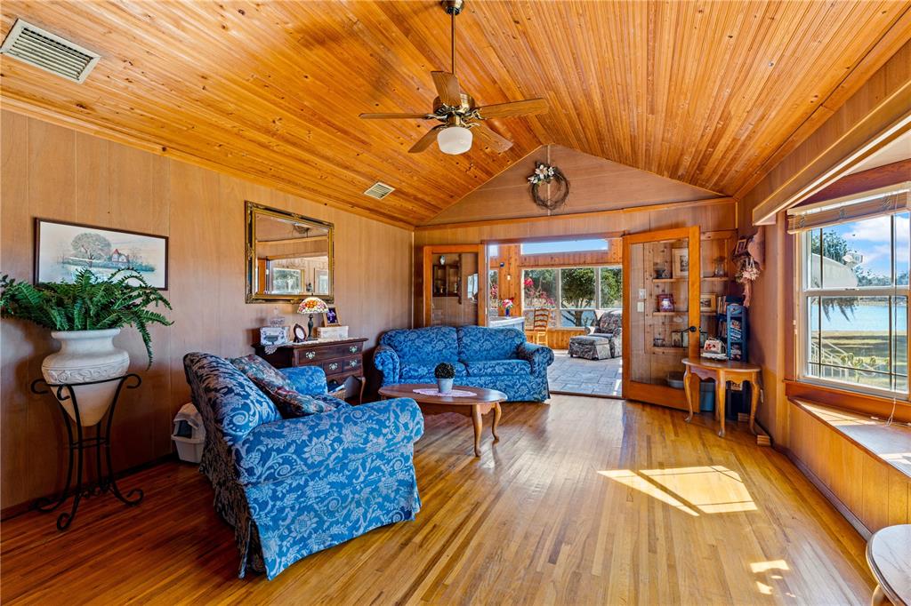 9504 Fort King Road Dade City, FL 33525 - Photo 12 of 51 a living room with furniture and wooden floors