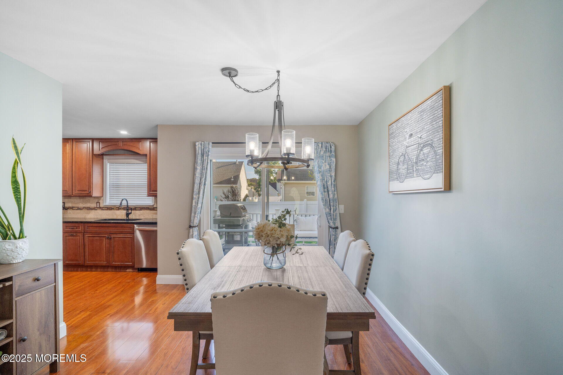 18 Red Maple Drive Brick, NJ 08724 - Photo 9 of 28 a dining room with furniture a chandelier and wooden floor