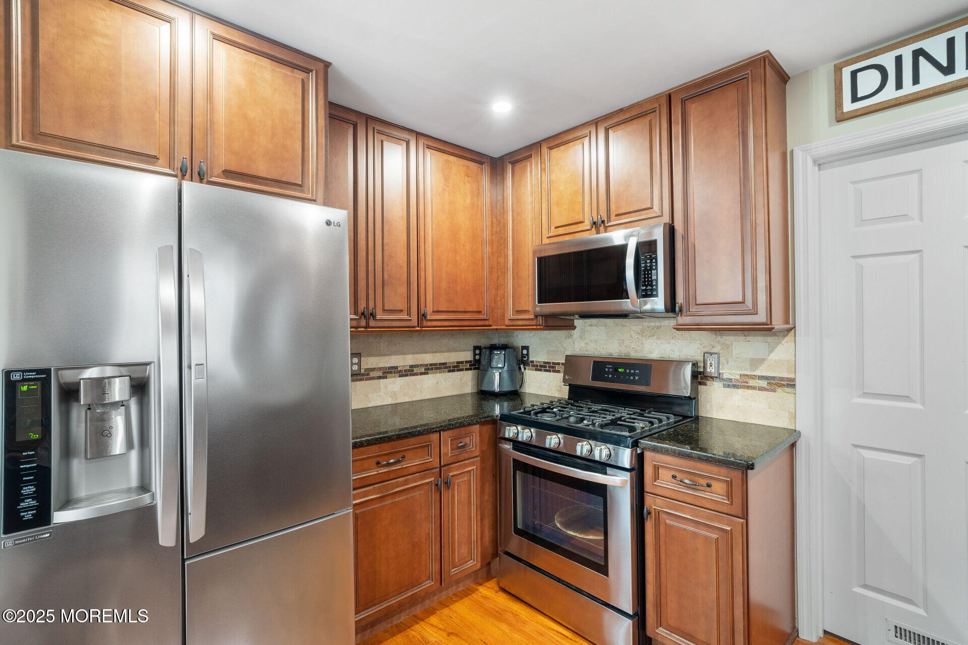 18 Red Maple Drive Brick, NJ 08724 - Photo 10 of 28 a kitchen with stainless steel appliances granite countertop a refrigerator stove and microwave