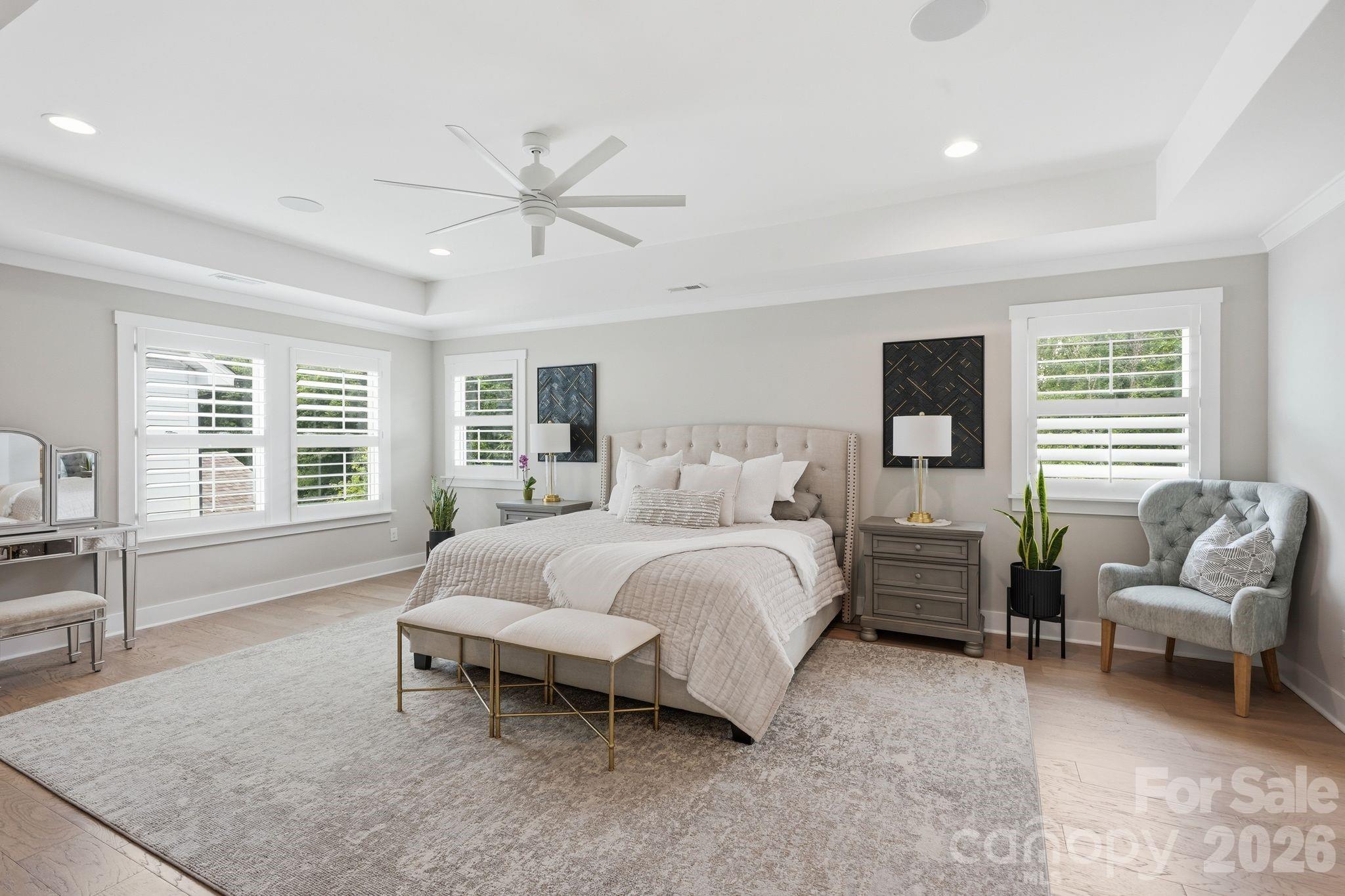 1086 Weir Court Fort Mill, SC 29708 - Photo 20 of 40 a spacious bedroom with a bed and a couch