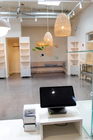 a kitchen with a table and chairs