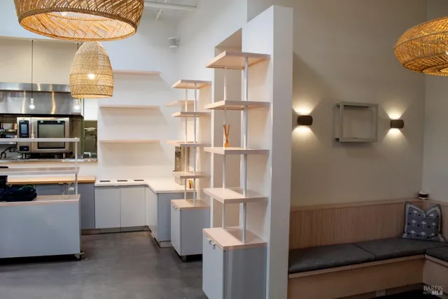 a kitchen with cabinets and window