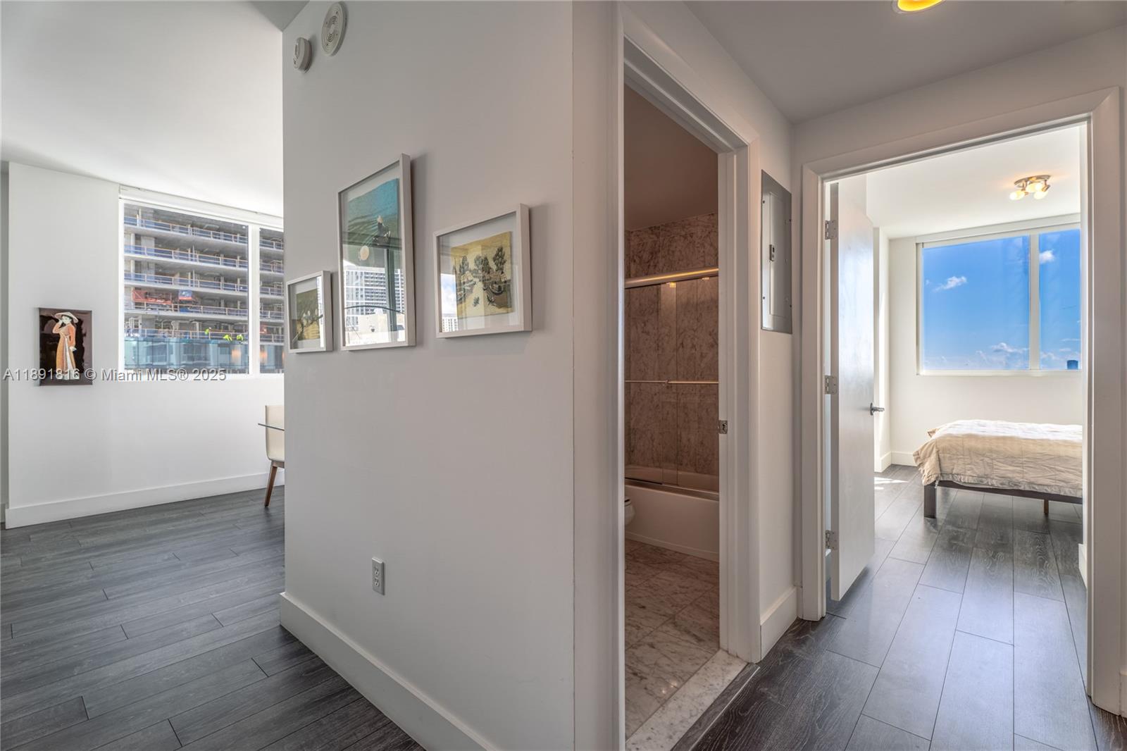 253 Northeast 2nd Street, Unit 3203 Miami, FL 33132 - Photo 13 of 29 a view of a livingroom with furniture and hardwood floor