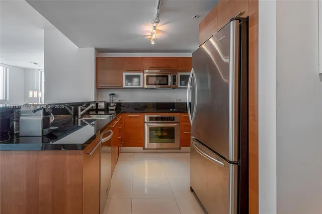 a kitchen that has a sink and a stove