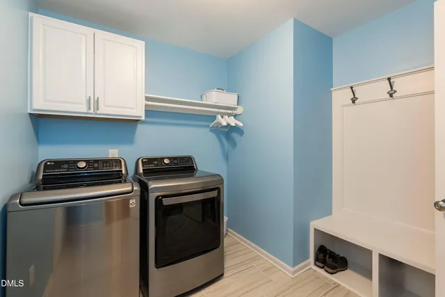 a close view of a stove top oven and cabinets