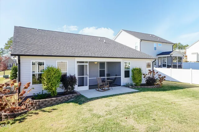 a front view of house with yard and outdoor seating