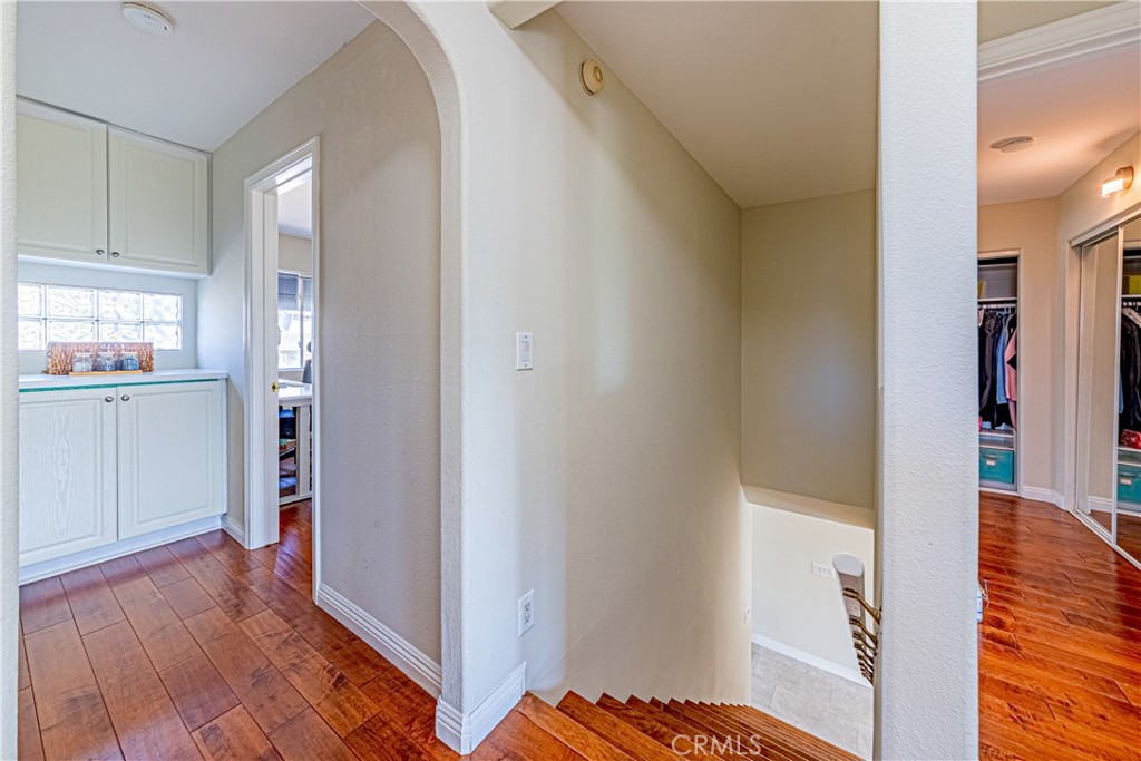 774 Stephens Avenue Fullerton, CA 92833 - Photo 16 of 53 a view of a hallway with wooden floor and cabinet